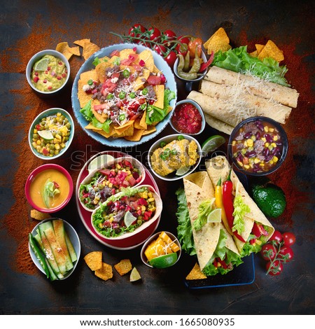 Traditional Mexican food mix on dark background. Top view, flat lay