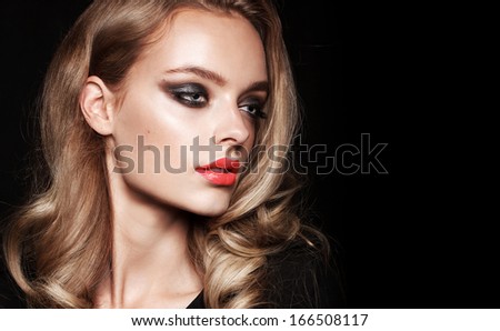 Young fashion model with make up and red lips, portrait