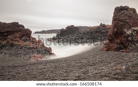 Long exposure of Iceland Beach with lava rocks