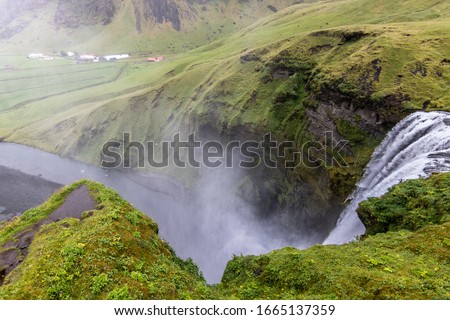 Skogafoss Waterfall Top Picture with Grass all Around Nature Concept