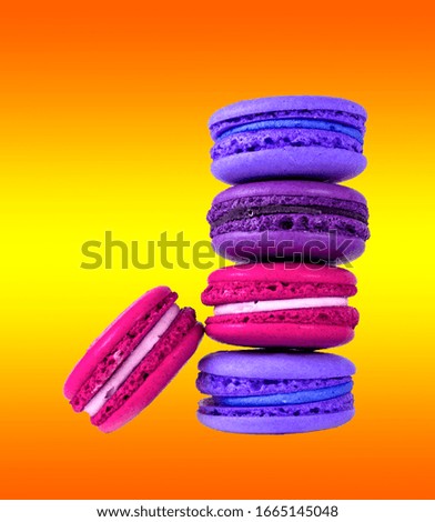 Close-Up Of Macaroons Against yellow Background