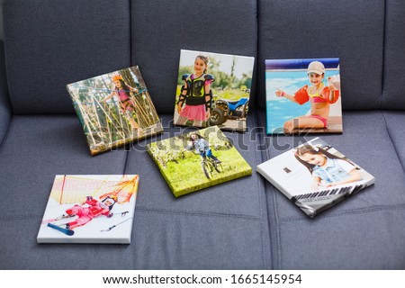 Photography canvas prints. Stacked colorful photos with gallery wrapping method of canvas stretching on stretcher bar, lateral side
