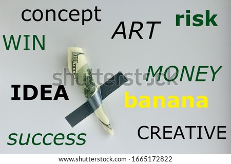 Money duct taped to the wall with text, words concept, win, art, risk, money, idea, banana, success, creative.Conceptual photo. Background for sticker, t-shirt screen printing. 