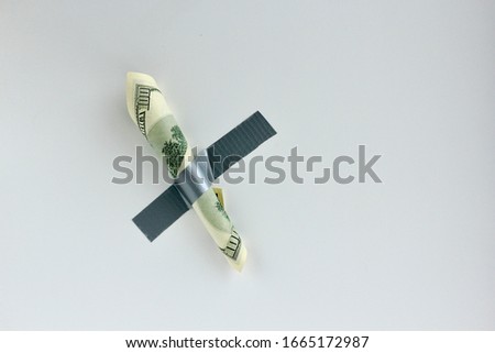 Money duct taped to the wall.Conceptual photo. Background for sticker, t-shirt screen printing. Copy space.