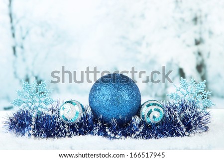 Composition of the Christmas decorations on light winter background
