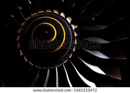 Aircraft turbojet engine in the dark close up, airfiel engineering background Royalty-Free Stock Photo #1665210472
