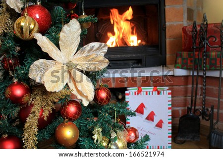 Christmas Tree and Christmas gift boxes in the interior with a fireplace 