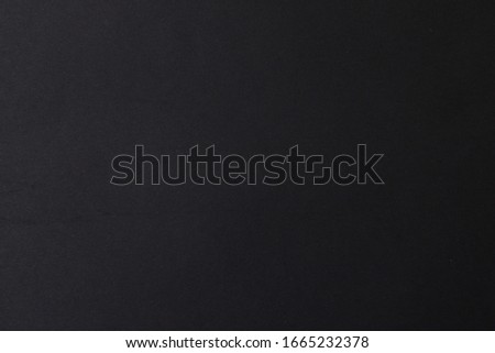 Black paper background, blank for design, place and space for inscription or text. Royalty-Free Stock Photo #1665232378