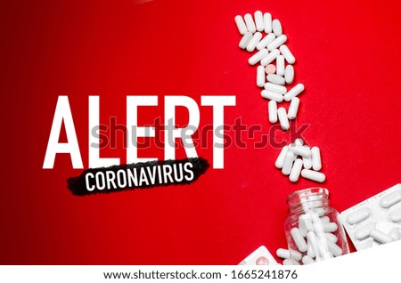 "Corona virus" alert with white pills. exclamation mark