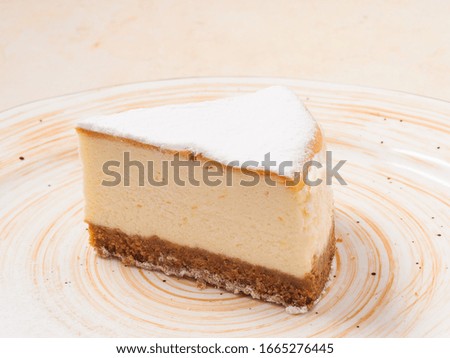 a slice of cheesecake on a plate. Close up