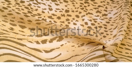 Collection of textural background, silk fabric, African theme, animal skins, brown tones.