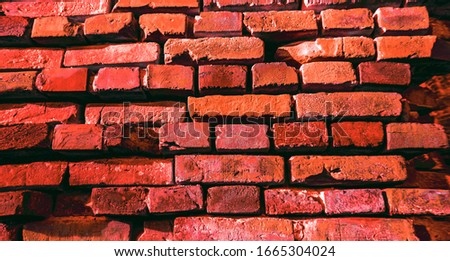 Brick stone wall rough red surface as backdrop background texture