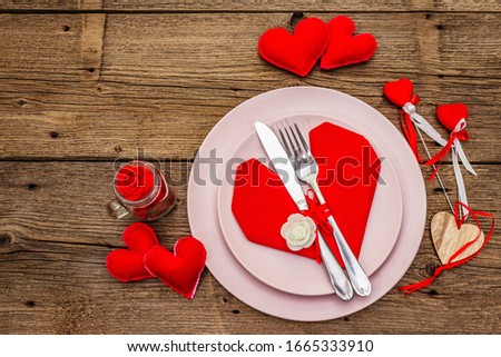 Romantic dinner table. Love concept for Valentine's or mother's day, wedding cutlery. Vintage wooden boards background, top view, copy space Royalty-Free Stock Photo #1665333910