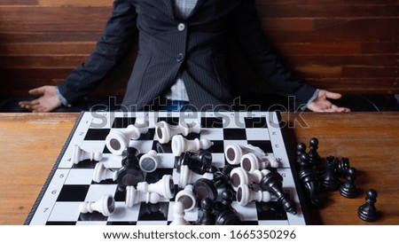Hand of player chess, illustrate business person planing. Business strategy for win and success.
