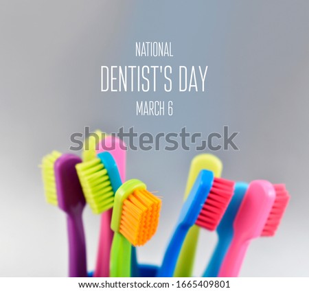 National Dentist's Day images. Colored toothbrushes stock images. Morning hygiene images. Bathroom accessories images. Toothbrush on a silver background. Dentists Day Poster, March 6. Important day