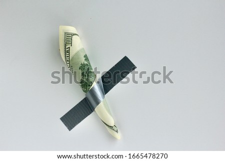 Money duct taped to the wall.Conceptual photo. Background for sticker, t-shirt screen printing. Copy space.