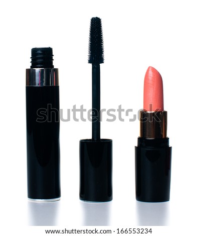 Cosmetic and makeup set: open lipstick and mascara on white background, isolated