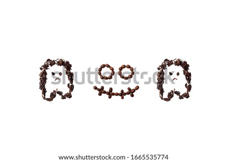 Halloween themed shapes made with roasted coffee beans and dried tea leaves placed on white background from the top view has space for your messages