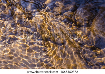 Stone bottom texture of spring mountain river