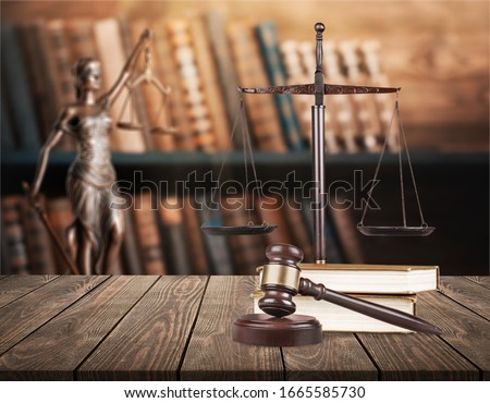Justice Scales and books and wooden gavel on table. Justice concept