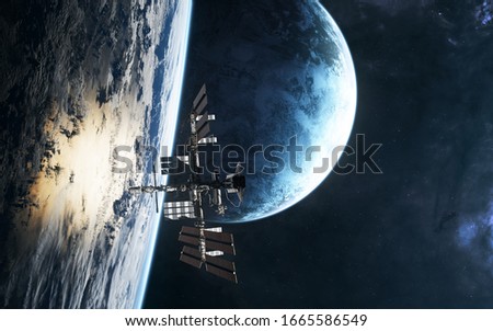 Space station on background of planets in deep space. Science fiction. Elements of this image furnished by NASA