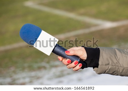 hand hold microphone for interview. 