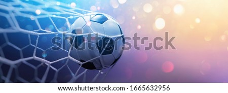 Soccer Ball in Goal on Multicolor Background Royalty-Free Stock Photo #1665632956