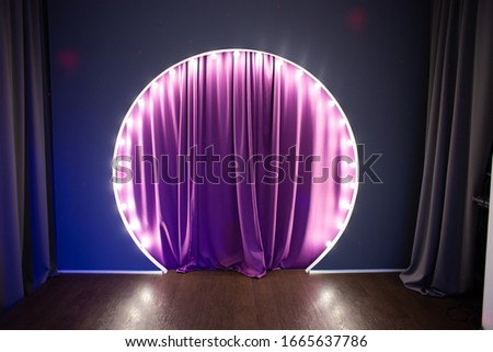 Scene with circular light bulbs. Podium with purple backstage and light