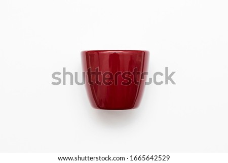 Empty red Flower Pot Mock-up. Closeup isolated on white background. Design template for branding.High resolution photo.