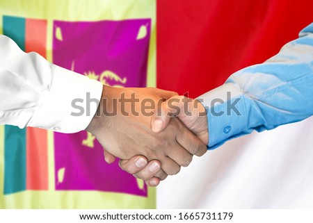Business handshake on the background of two flags. Men handshake on the background of the Sri Lanka and Monaco flag. Support concept