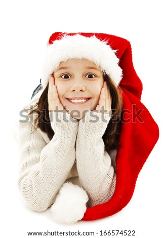 Excited Little girl in red Santa hat. Isolated on white background 