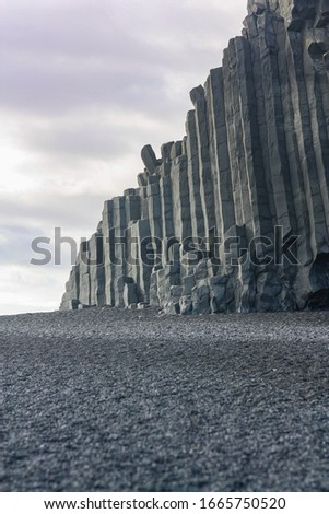 Light basalt column formation in Iceland. Background.