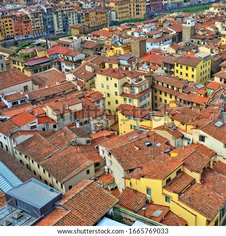 Aerial view. Nice buildings with red tile roofs in the old city. Italian culture and architecture. Urban landscape. Italy, Florence   