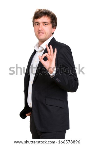 Smiling businessman showing ok sign on a white background
