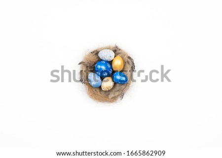 Frame of Easter golden decorated eggs in nest isolated on white background for web banner. Minimal easter concept. Happy Easter card with copy space for text. Top view, flatlay.