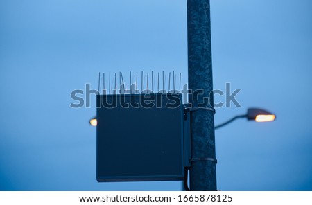 Metallic electric street lights controller with blue sky background photo
