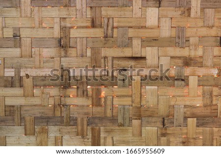 Closeup of vintage handmade  bamboo wall. The traditional way of living in simply way. A natural art background, template and other artworks.