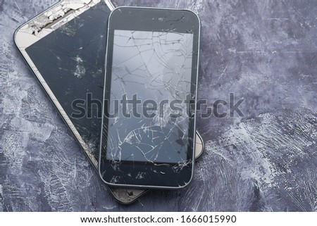 top view of broken smart phone on white background 
