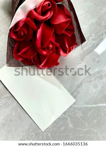 Red rose with message card.Image of Valentines day.