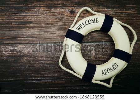 Lifebuoy Marine Decoration with space copy on wooden background