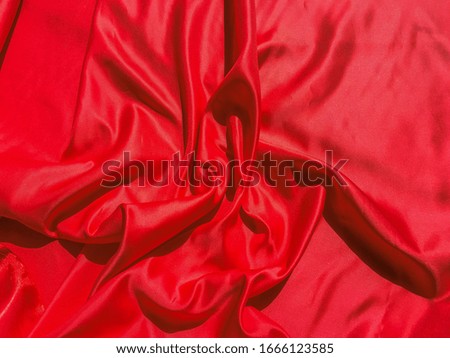 Red fabric texture for background with copy space. Valentines Day or Christmas Day wallpaper design