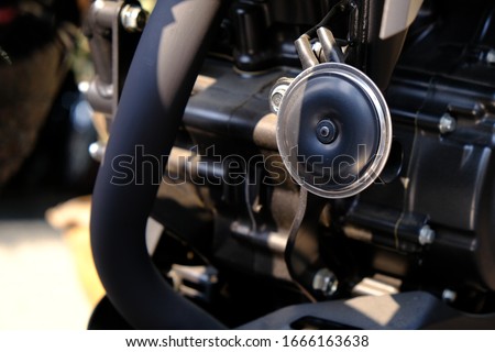 Picture of a close up of a motorcycle horn
