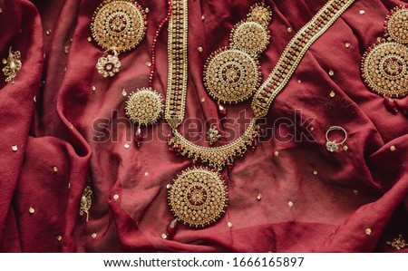 Pakistani Indian bridal yellow gold and red stones on kundan set Royalty-Free Stock Photo #1666165897