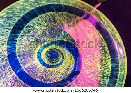 abstract close-up of purple spiral in yellow background
