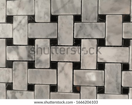 Weave style background, metal stripes cross each other full of space, on black plate.