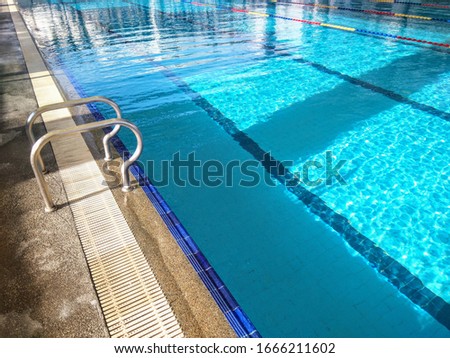 swimming pool with blue clear water in hotel and spa