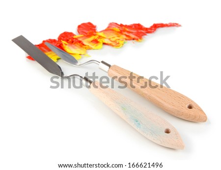 Painting palette knifes with paint isolated on white