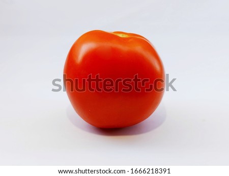 One tomato isolated on white background.

 Fresh red tomato 