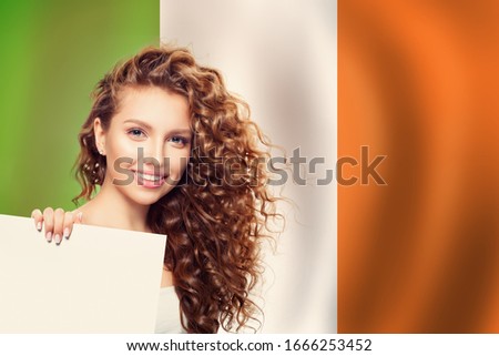 Love Irish concept. Happy cute woman with white banner and Irish flag
