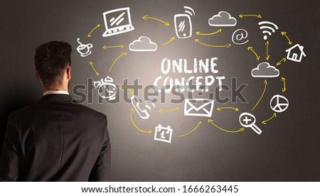 businessman drawing social media icons with ONLINE CONCEPT inscription, new media concept